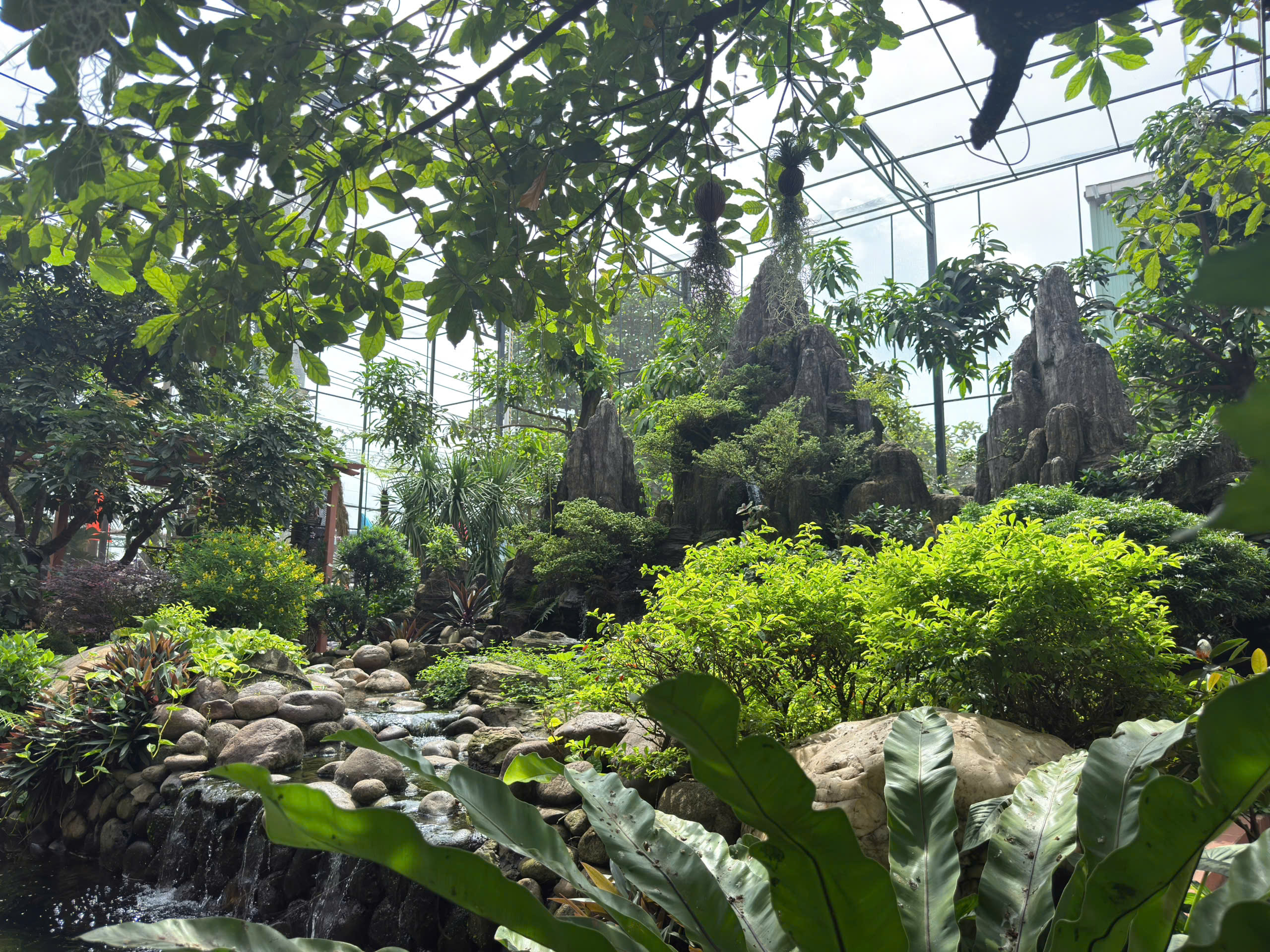Green space and open architectural design within the ecological Aviary at Thep Tay Do