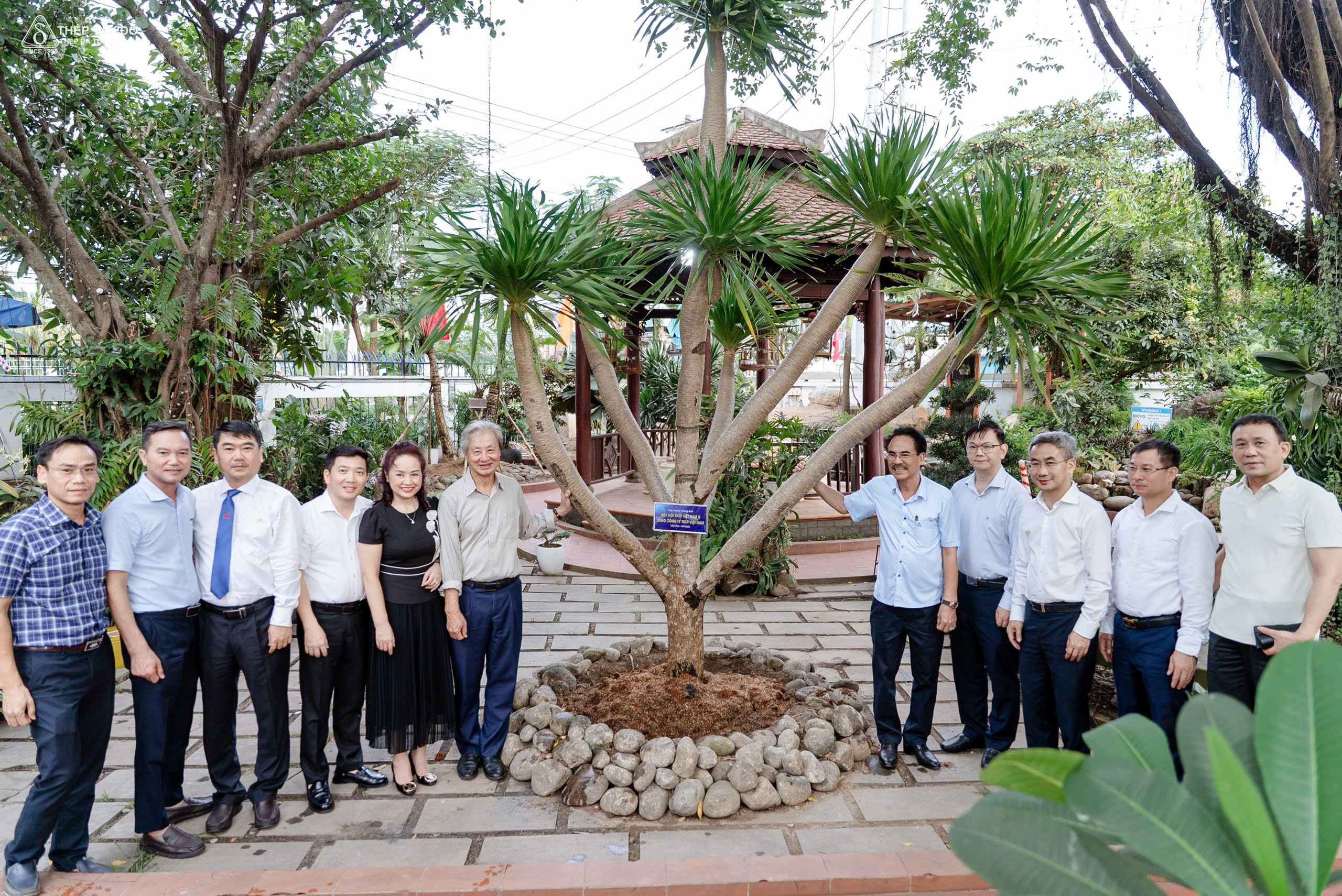 Delegation planting trees